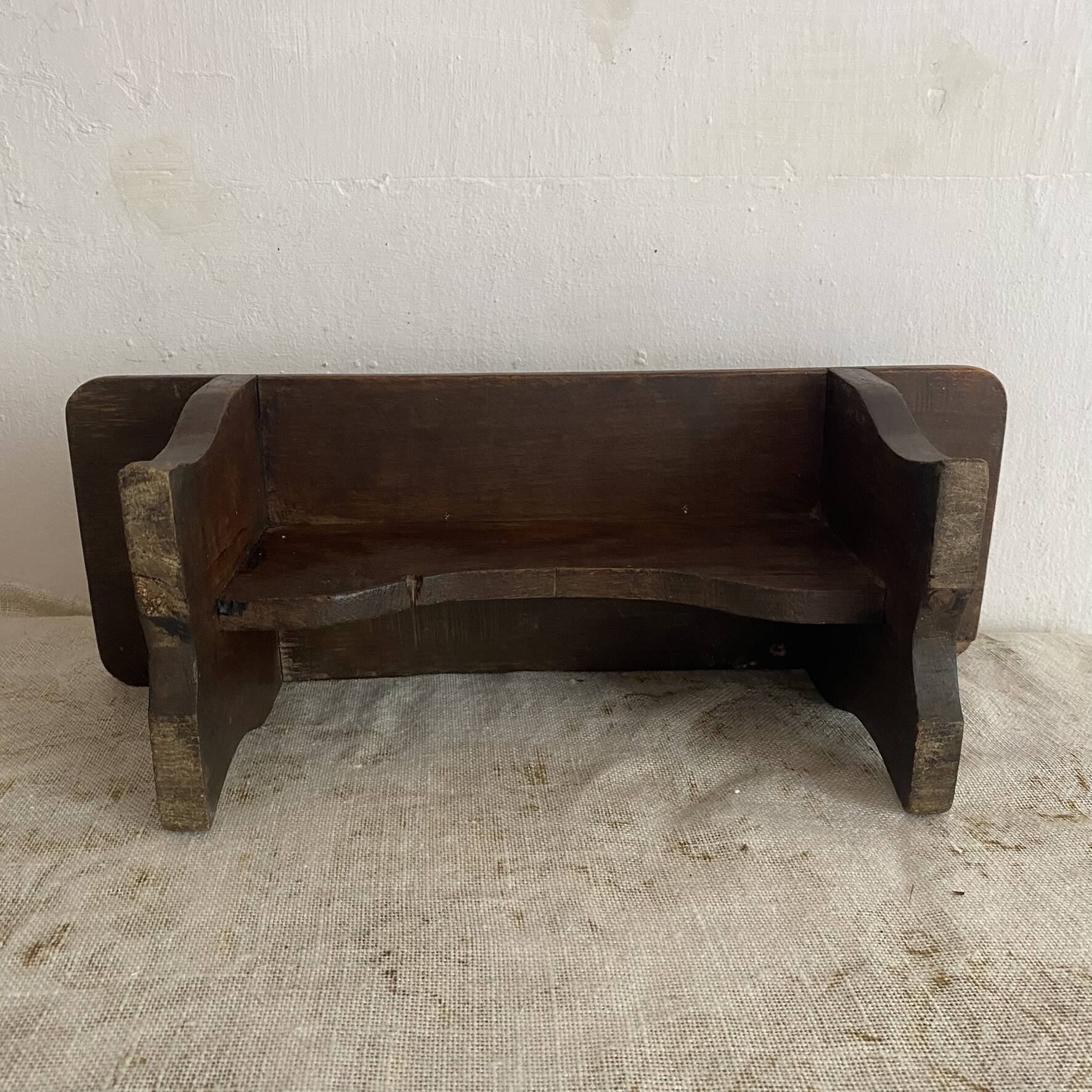 Old low stool made of solid wood