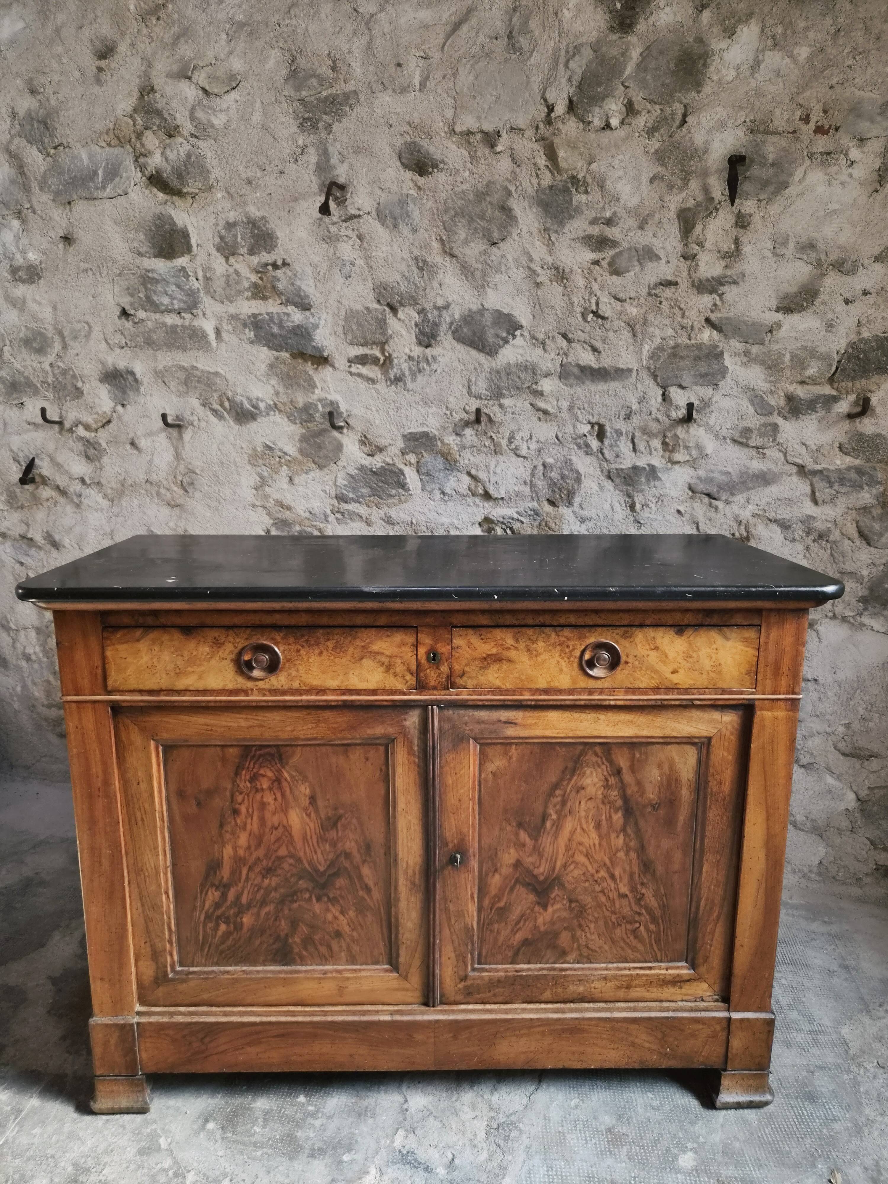 French Louis Philippe walnut buffet with black marble top, France, circa 1840–1860.