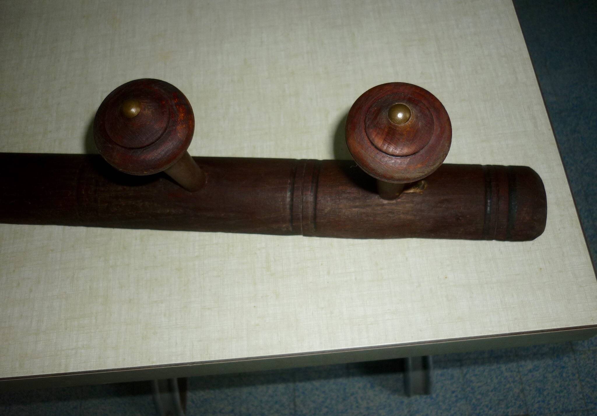 Wooden wall-mounted coat rack