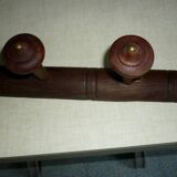 Wooden wall-mounted coat rack
