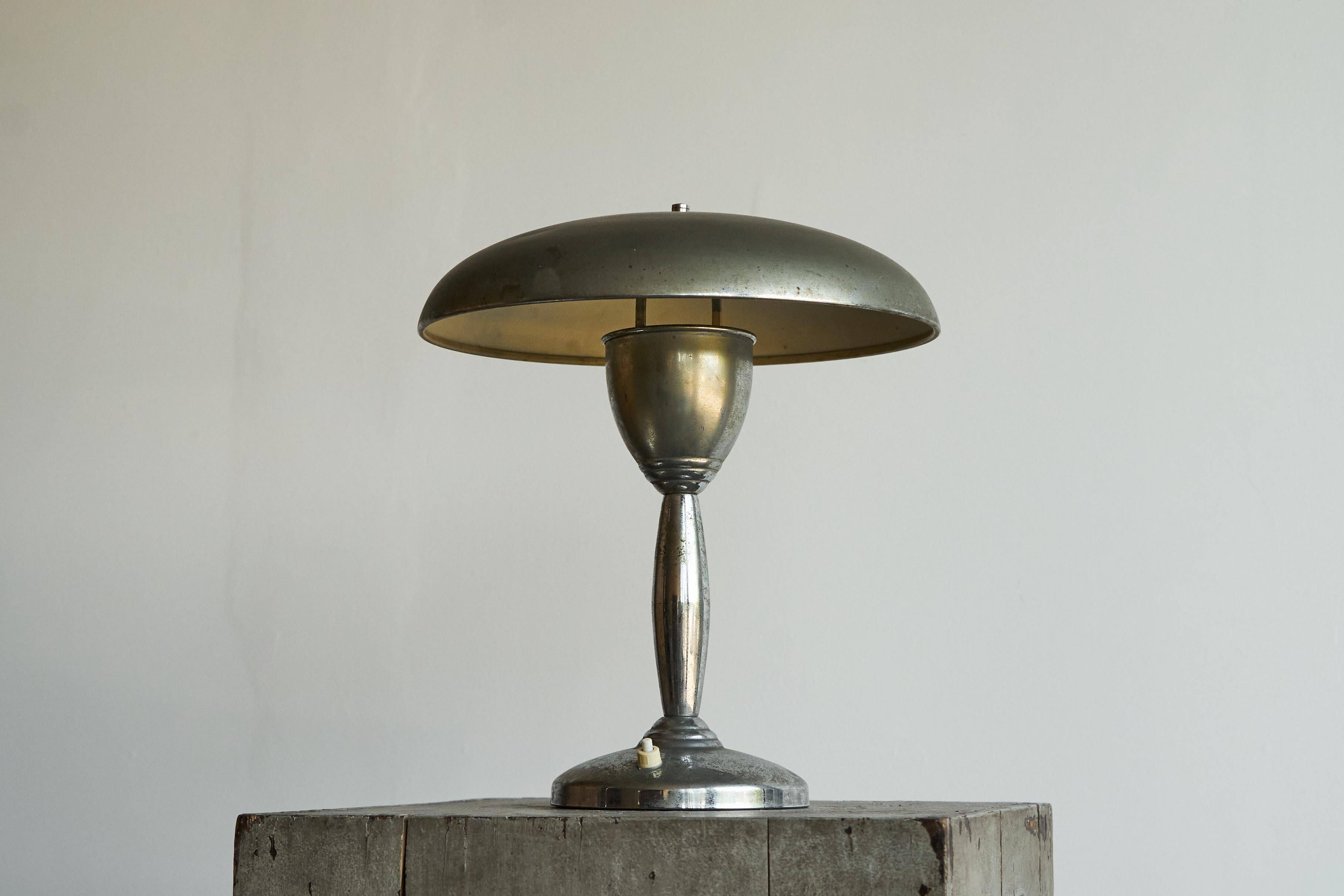 Patinated brass and chrome table lamp from the 1950s.