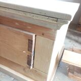 Base-shaped coffee table in light ash with a drawer and a compartment