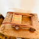 Vintage wooden folding doll's deckchair on wheels