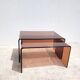 Pair of vintage smoked plexiglass nesting tables.