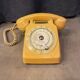 Old dial telephone from the 80s temat quimper bakelite yellow and beige