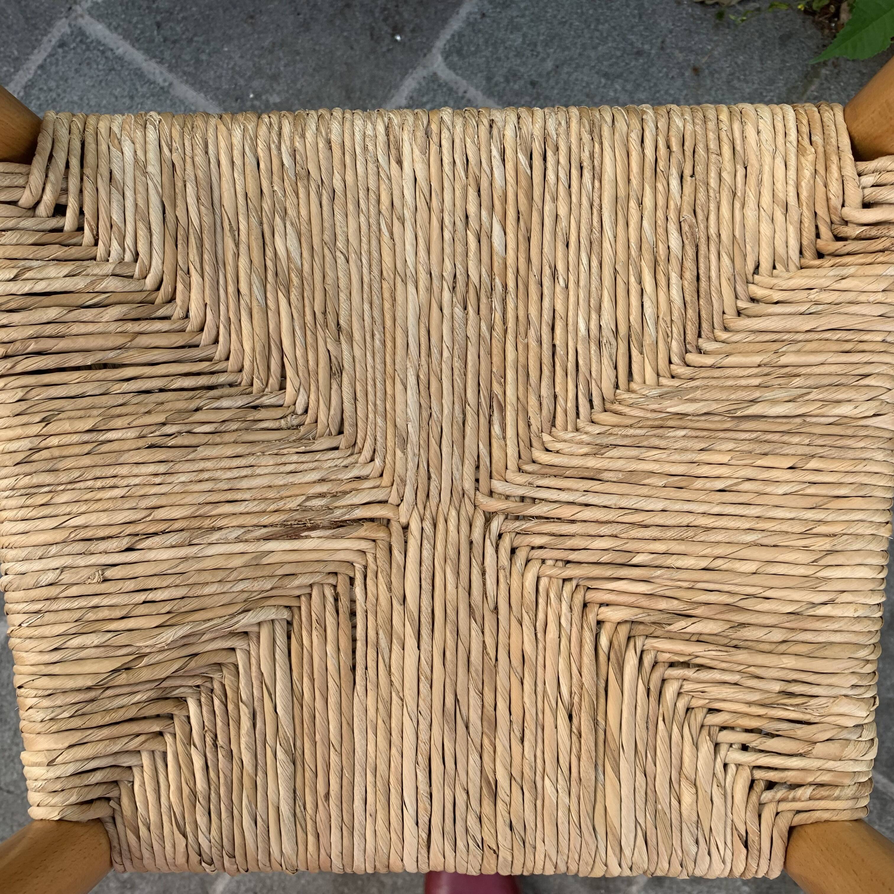 Old wooden and straw high chair for children