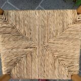 Old wooden and straw high chair for children