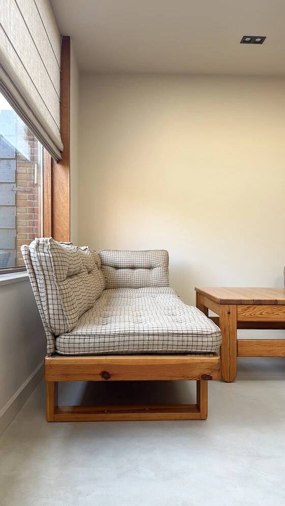 Two vintage Swedish sofas and a pine table