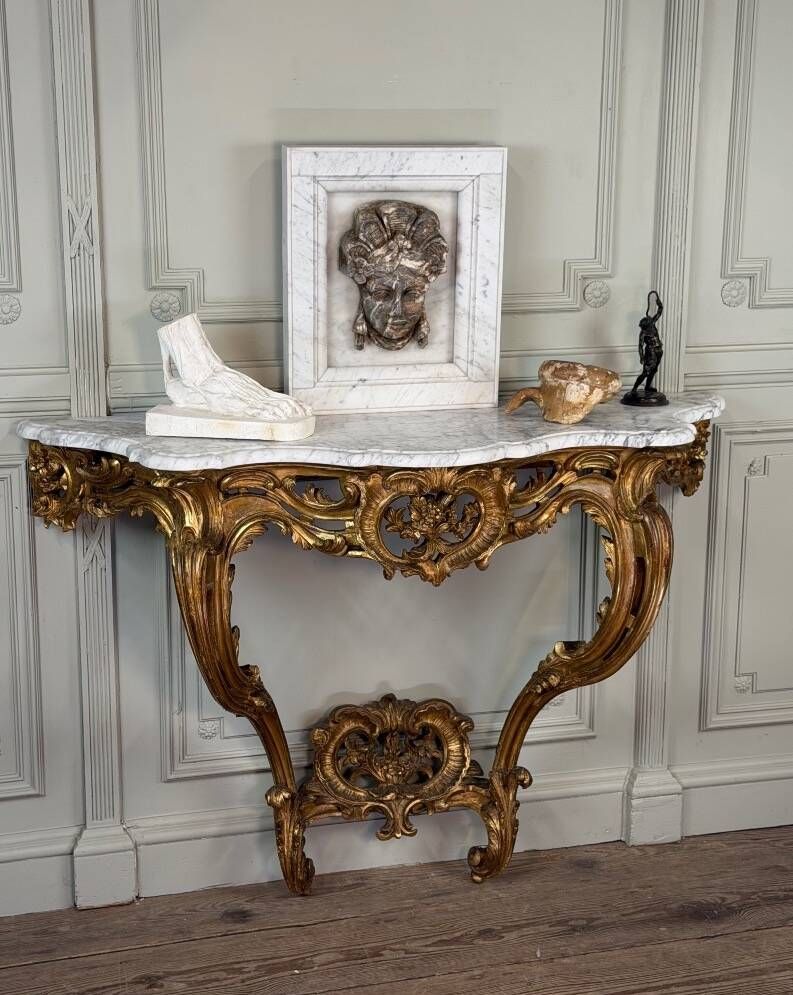 Louis XV style console in carved and gilded wood, circa 1880.