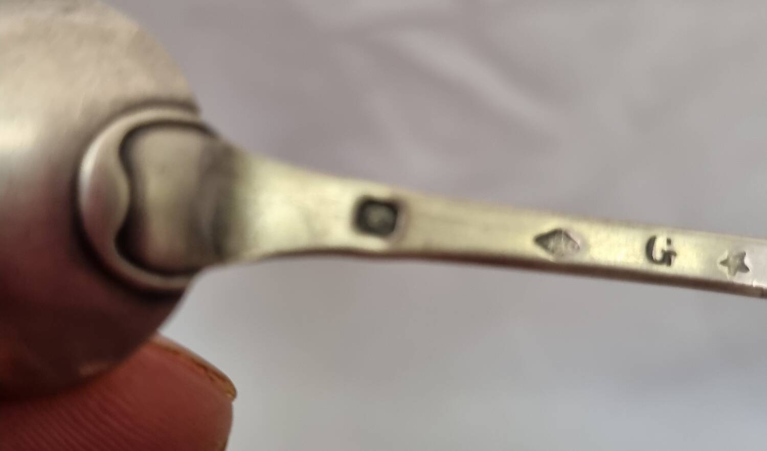 Solid silver spoon, neck brace