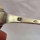 Solid silver spoon, neck brace