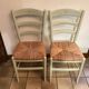 Pair of green straw sitting chairs