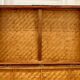 Beautiful vintage Chinese trunk in wicker, black and gold lacquered wood, and brass.