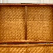 Beautiful vintage Chinese trunk in wicker, black and gold lacquered wood, and brass.