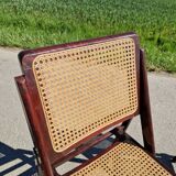Set of 2 folding chairs in wood and cane.
