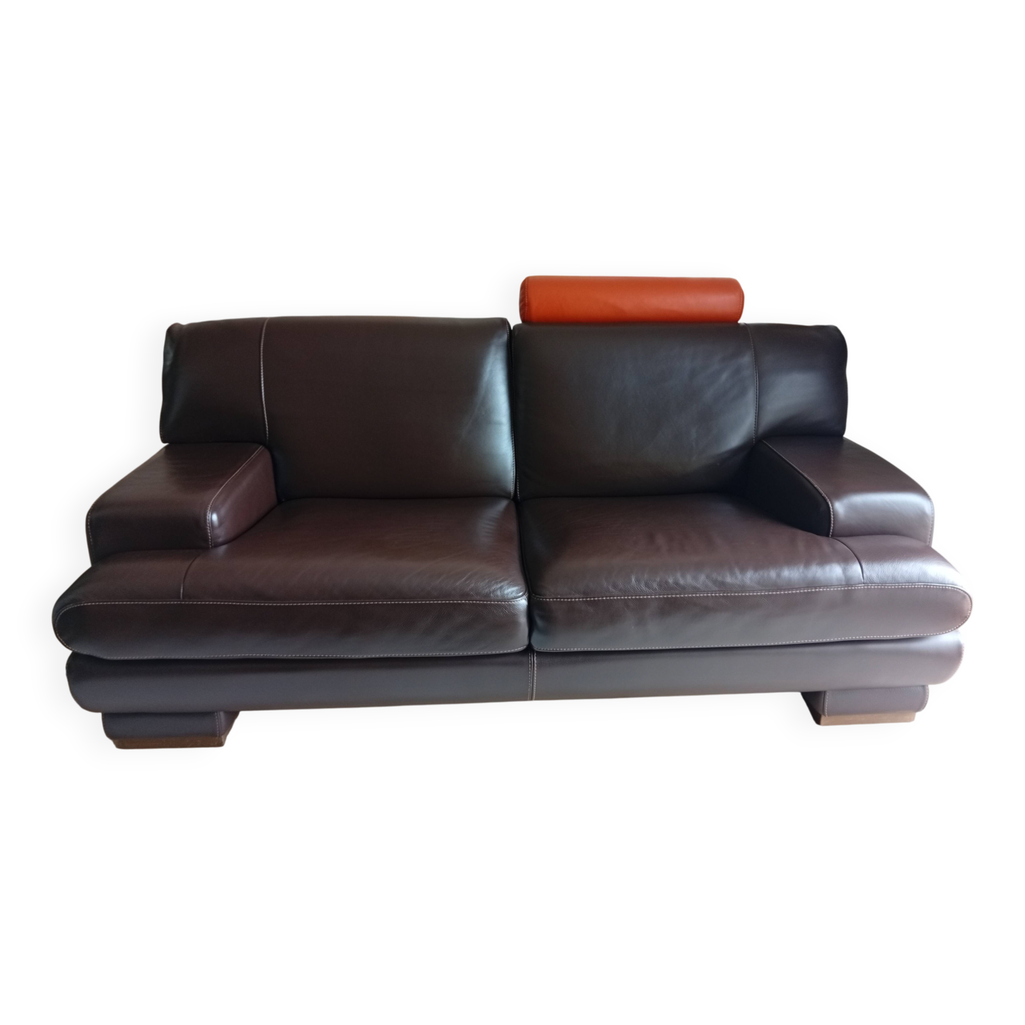 Two brown leather Crozatier two-and-a-half-seater sofas.