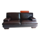 Two brown leather Crozatier two-and-a-half-seater sofas.