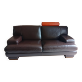 Two brown leather Crozatier two-and-a-half-seater sofas.