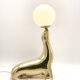 Vintage brass sea lion lamp