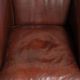 Characterful sheepskin club armchair in a dark cognac colour in English style
