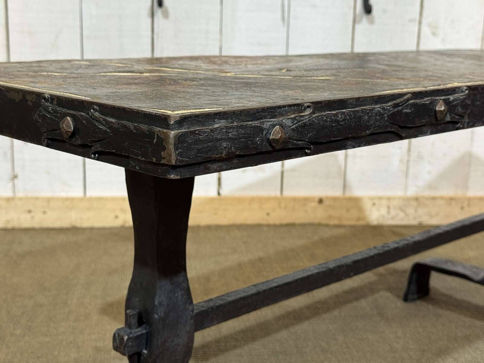 Coffee table in wrought iron with a slate top, work from the 1950s.