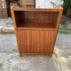 Brown trapezoidal wooden bar cabinet from the 1960s with a niche and lockable flap.