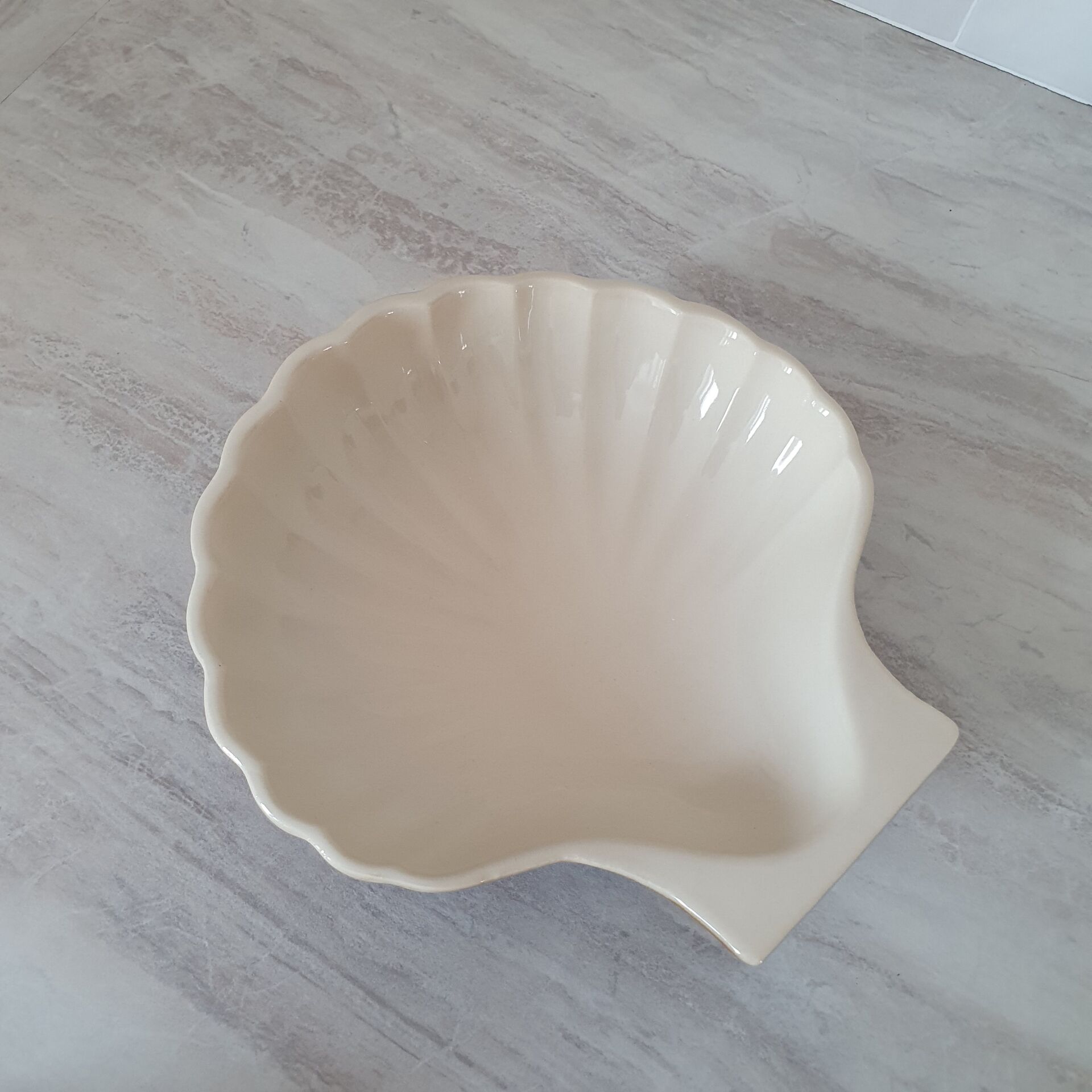 Brown and white ceramic shell bowl