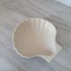 Brown and white ceramic shell bowl