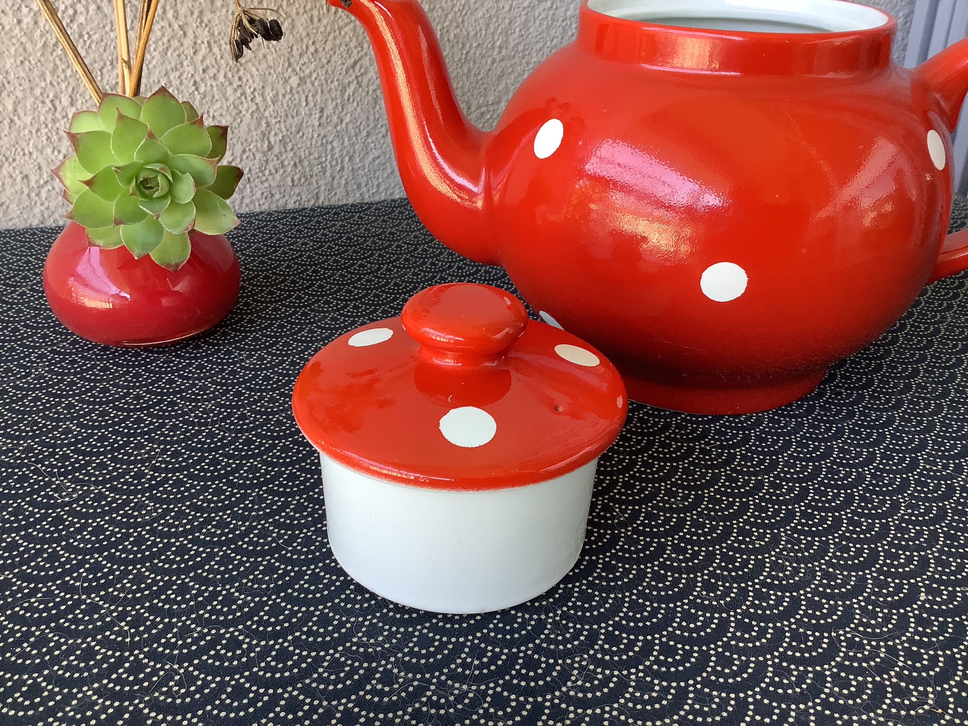 Vintage red teapot with white polka dots