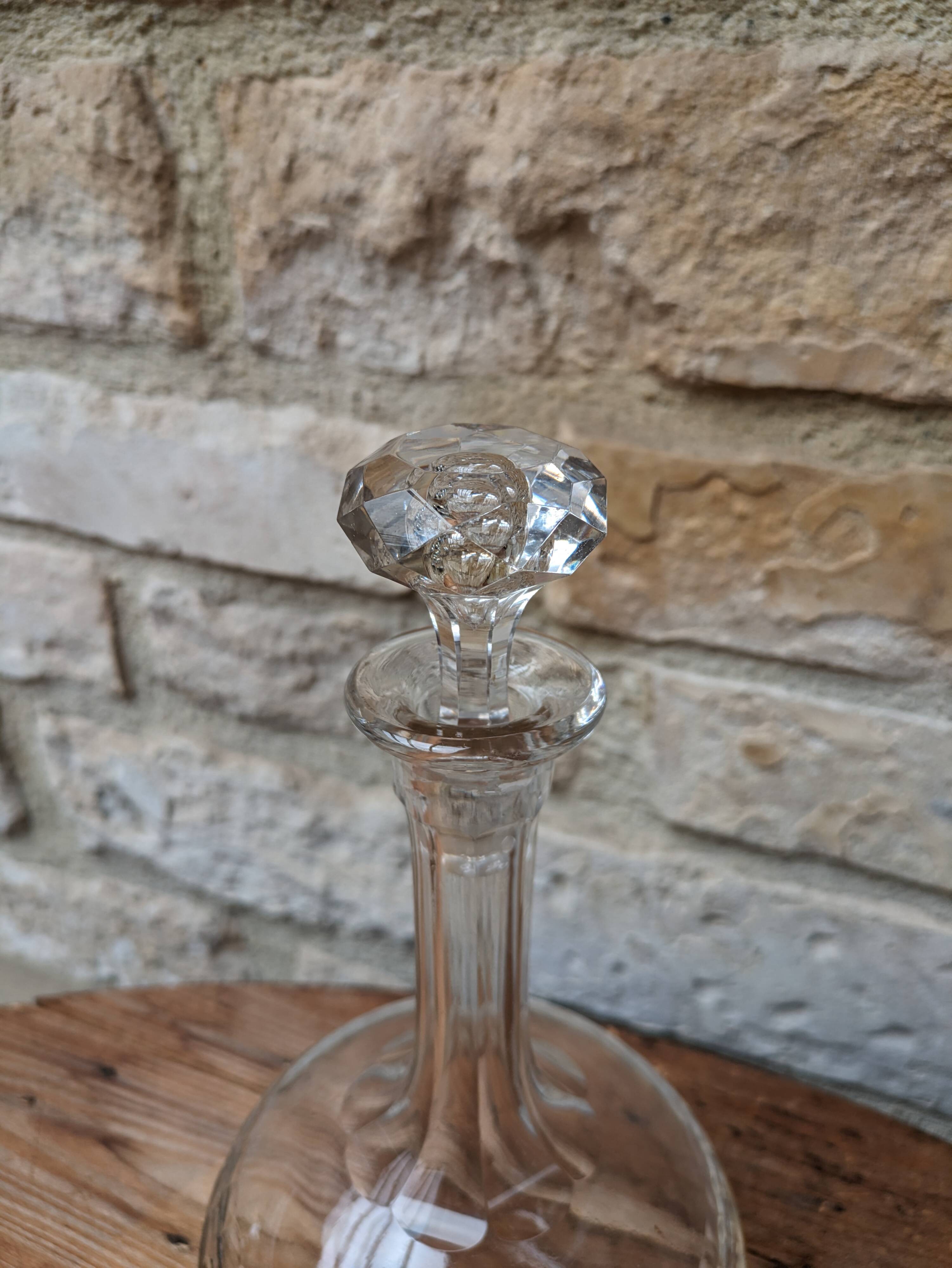 Antique round chiseled glass carafe with stopper