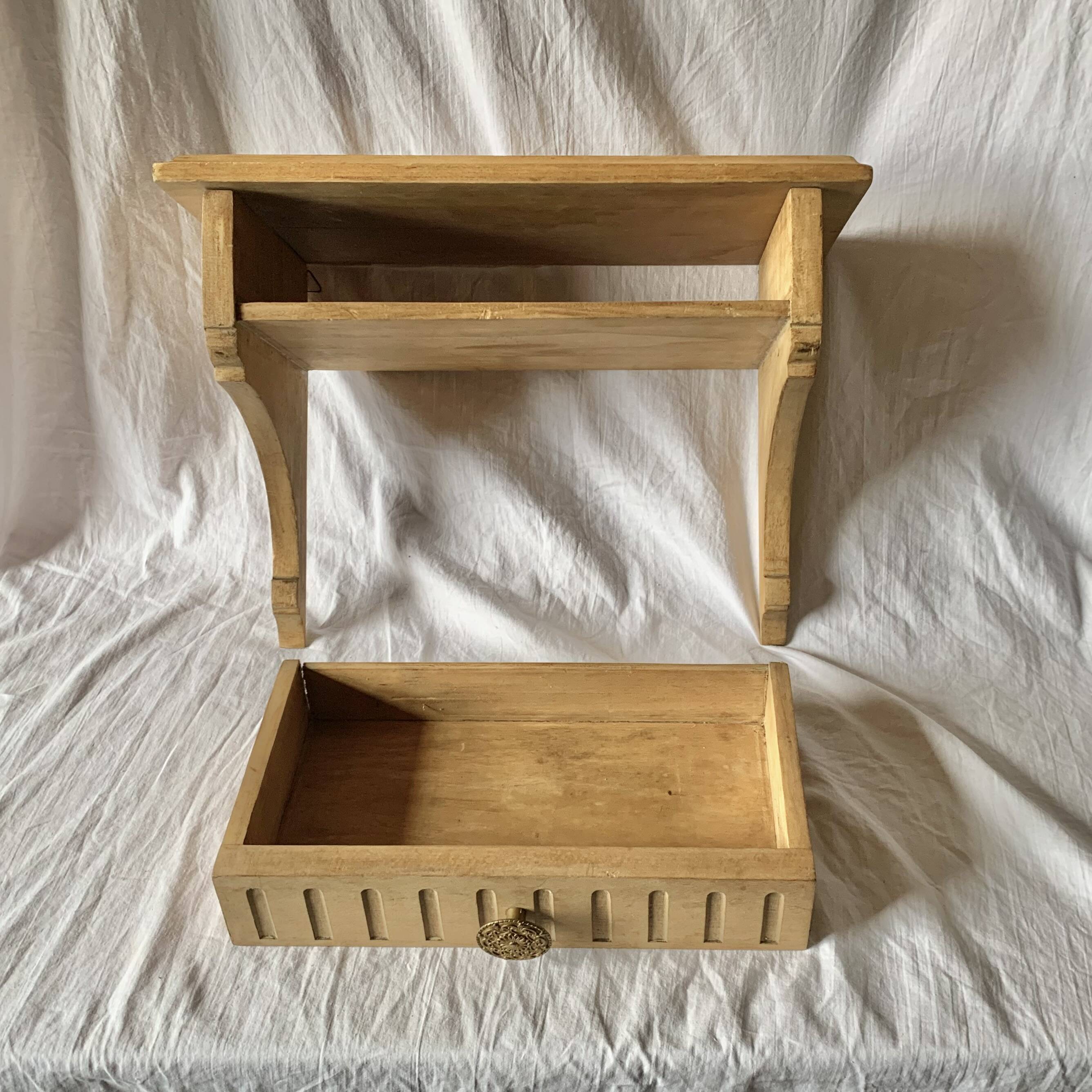 Old small hanging shelf in solid wood