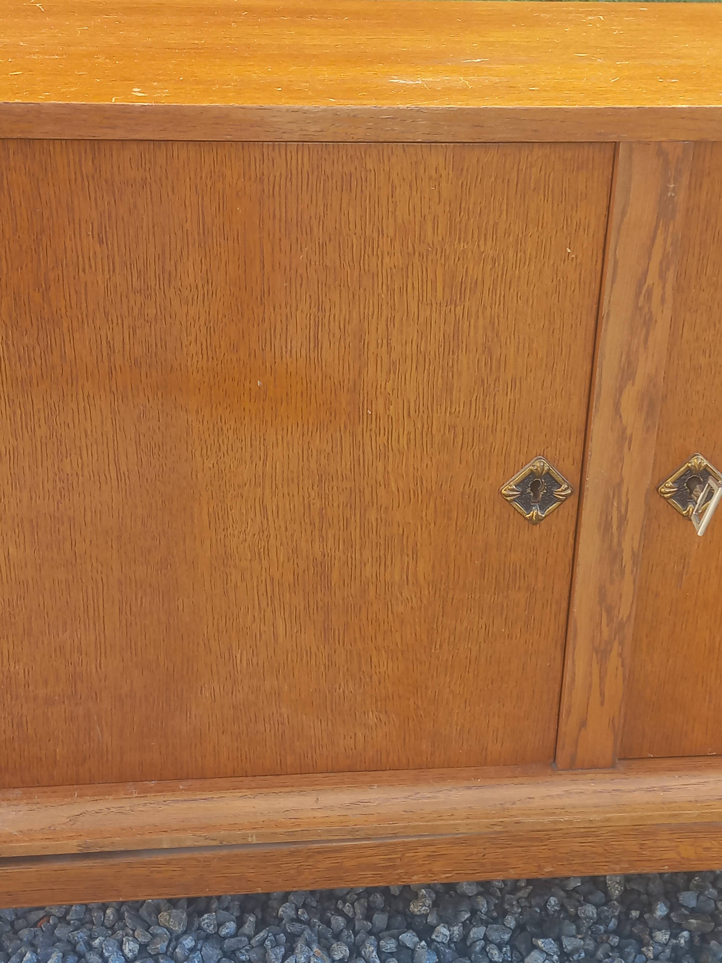 Vintage oak sideboard with splayed legs from the 1950s.