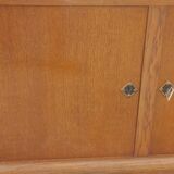 Vintage oak sideboard with splayed legs from the 1950s.