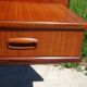 Vintage bed in teak with integrated bedside table.