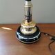 Vintage 70s lamp base in black and gold metal.