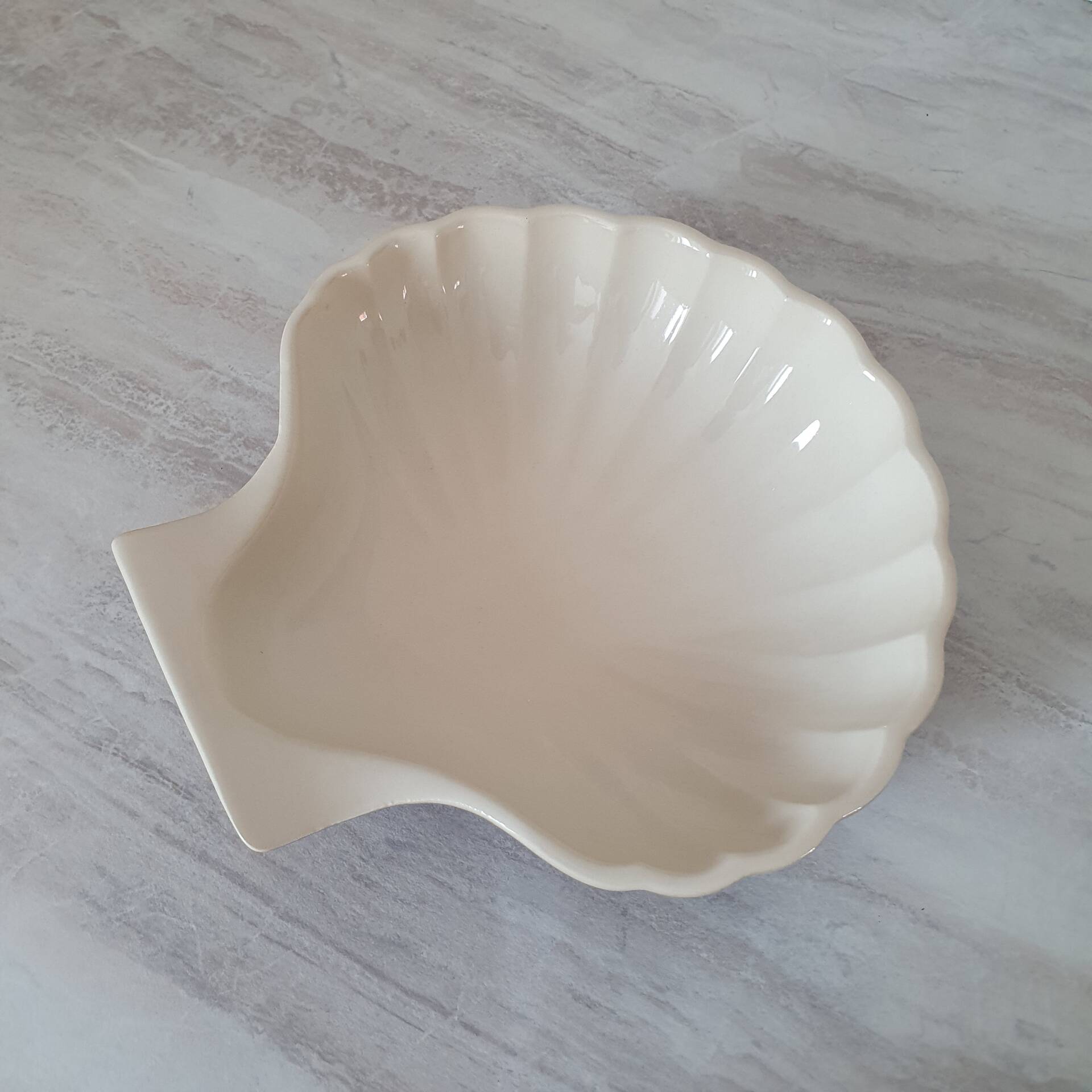 Brown and white ceramic shell bowl