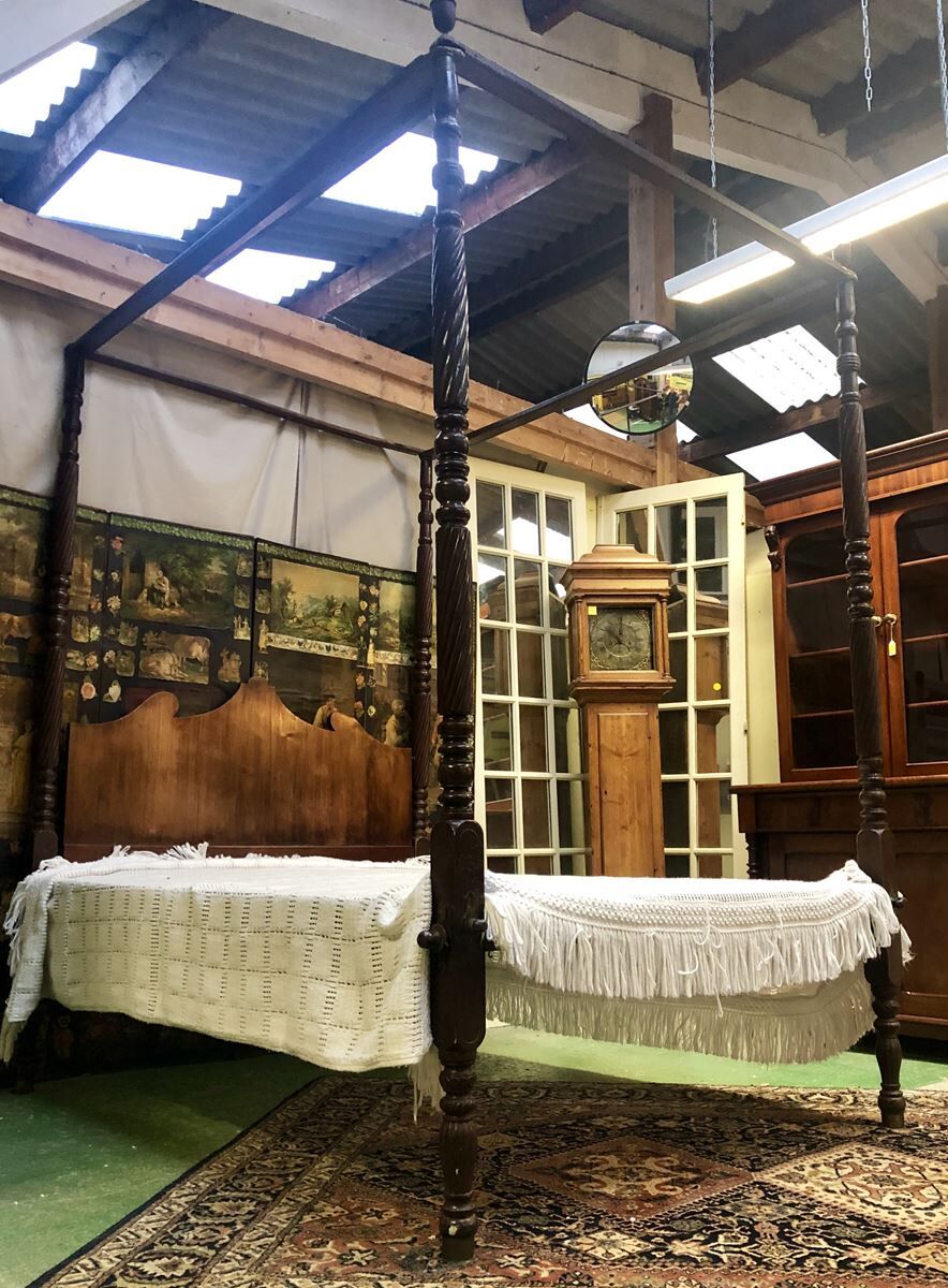Four-poster bed in late 19th century mahogany