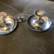 Pair of silver metal hand candle holders