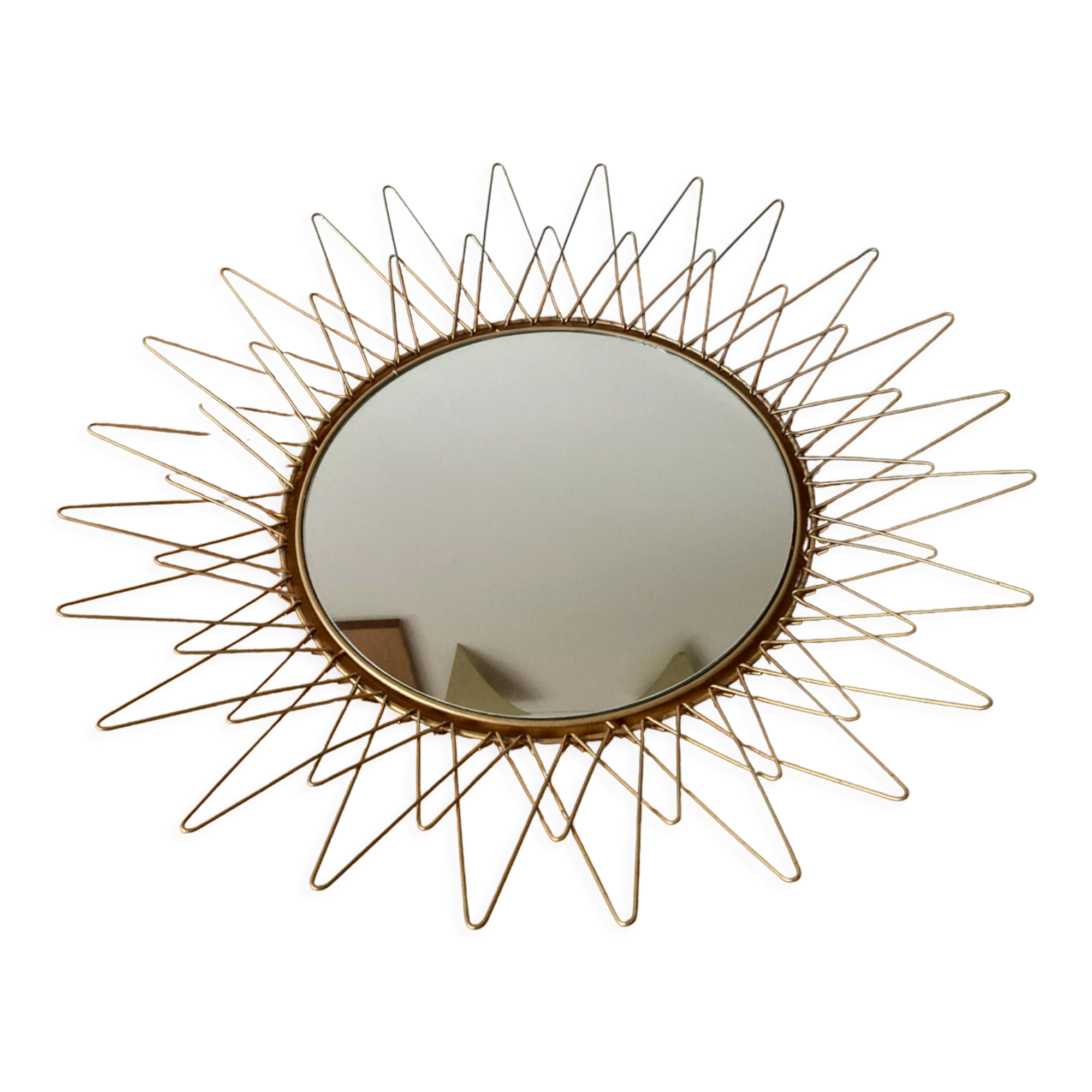 Sun mirror in gilded metal