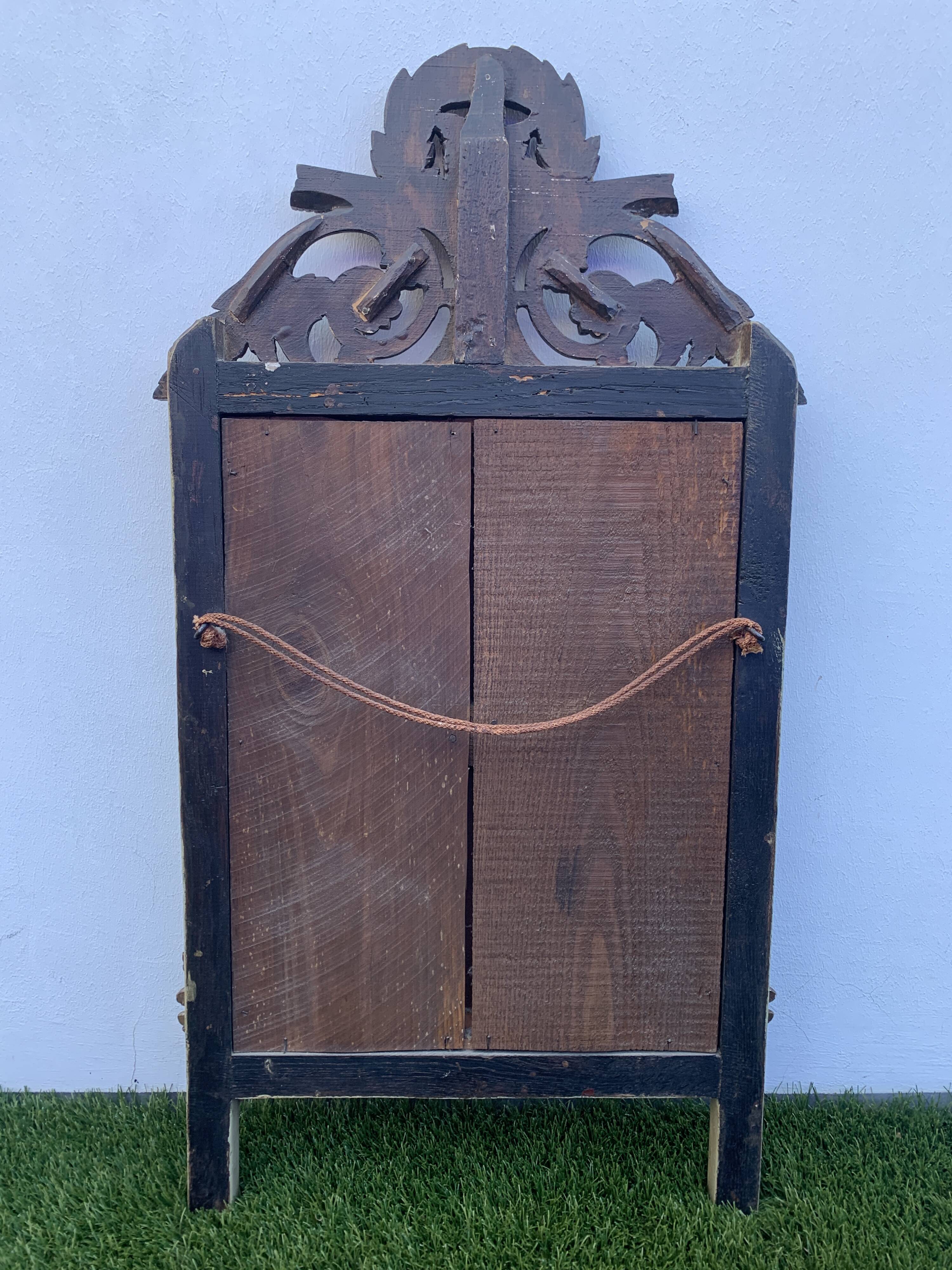 Antique mirror with gilded wood pediment, Louis XVI style