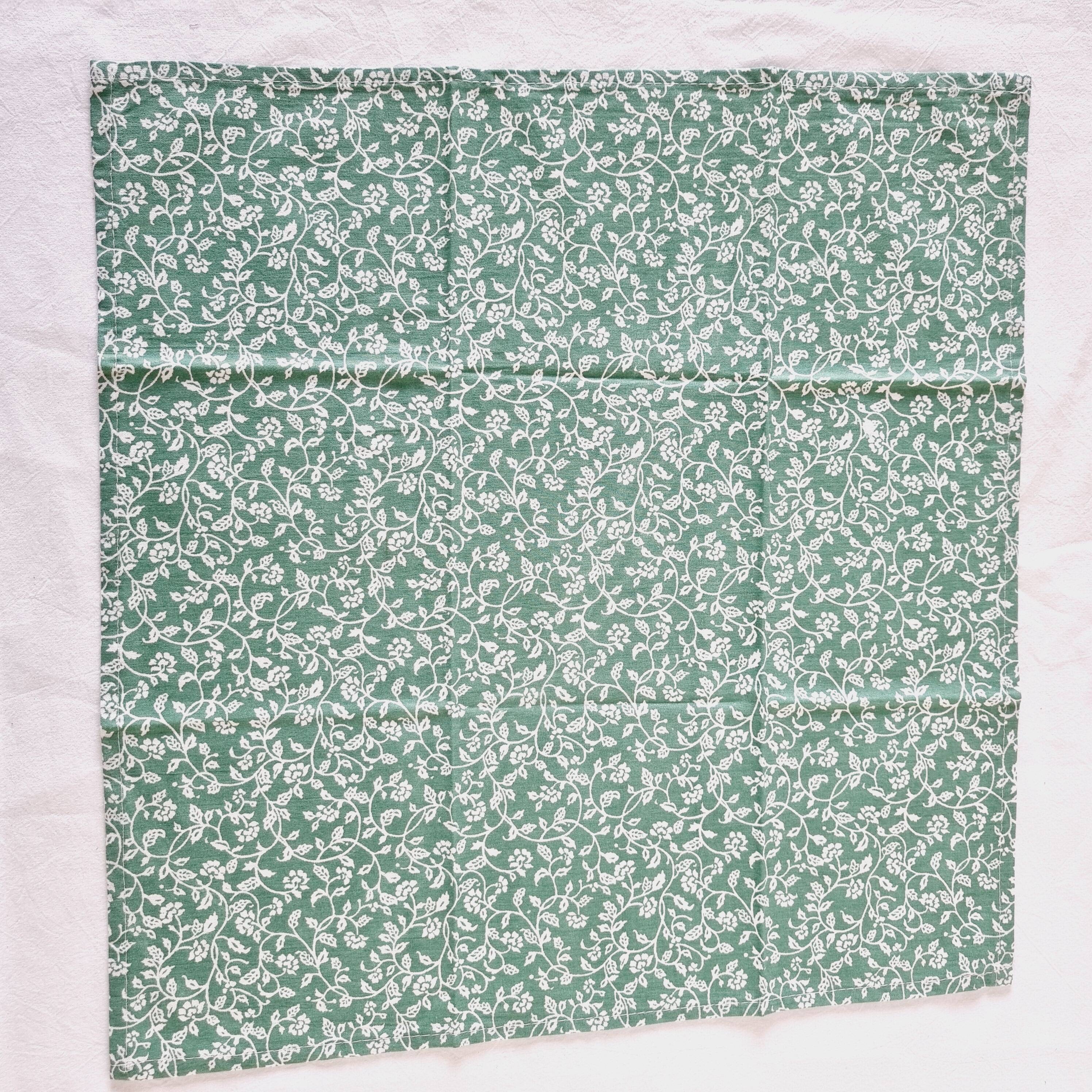 6 green cotton cloth napkins with white linens