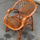 Adult rattan and wicker armchair, 1975, with beige cushion
