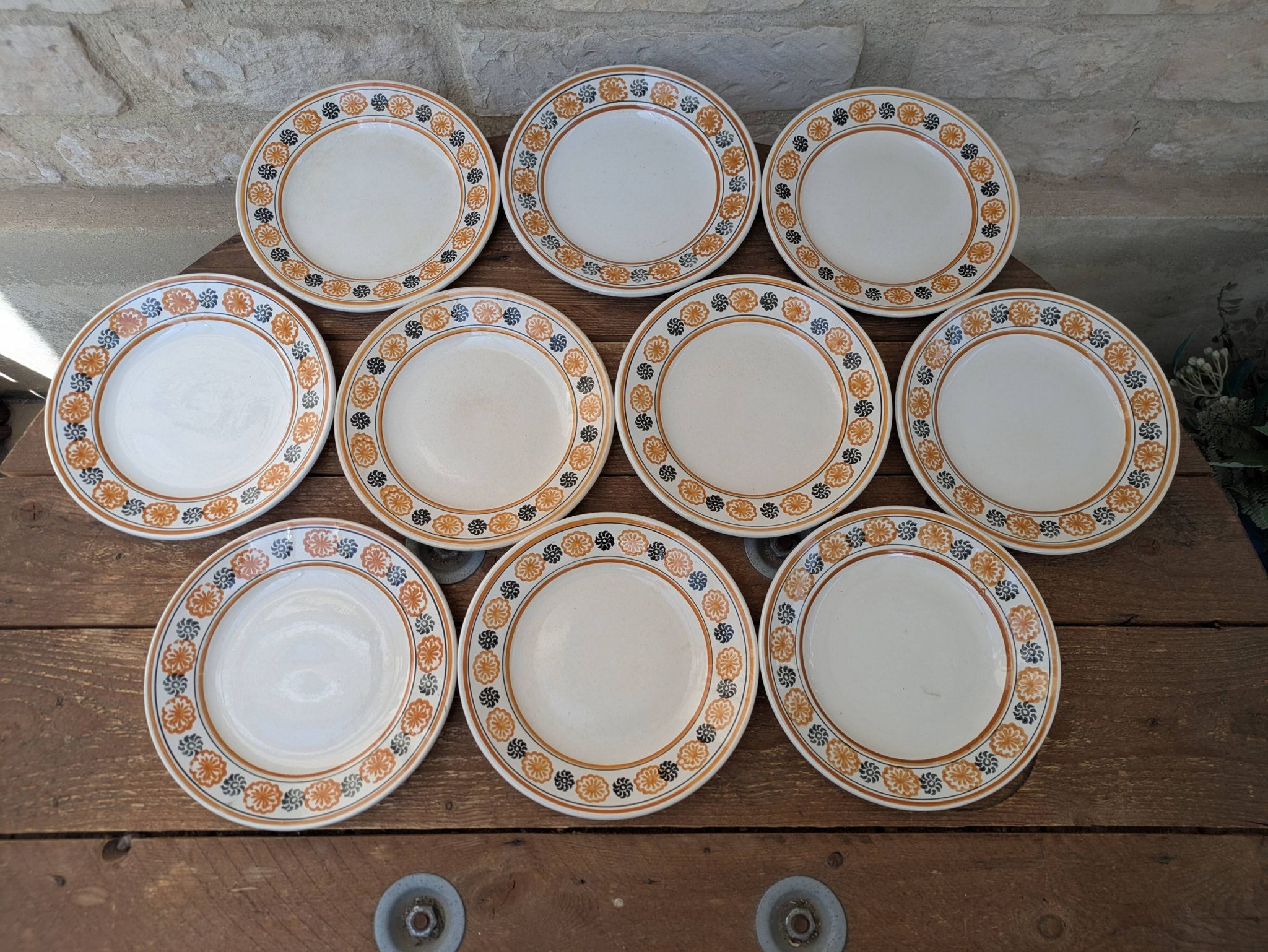 10 dessert plates Saint Amand Amandinoise frilled with orange and black flowers.