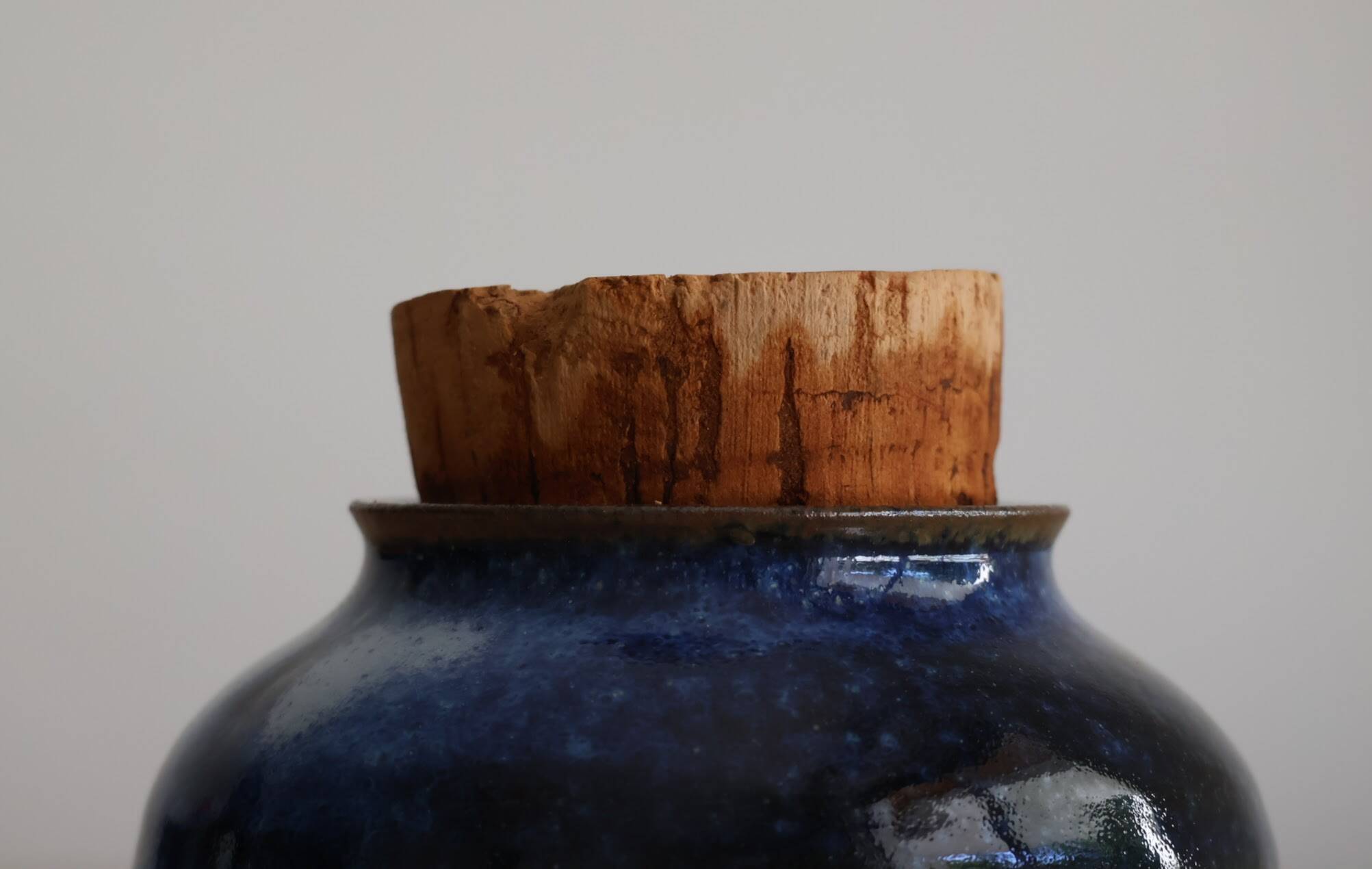 Blue glazed stoneware pot with cork stopper