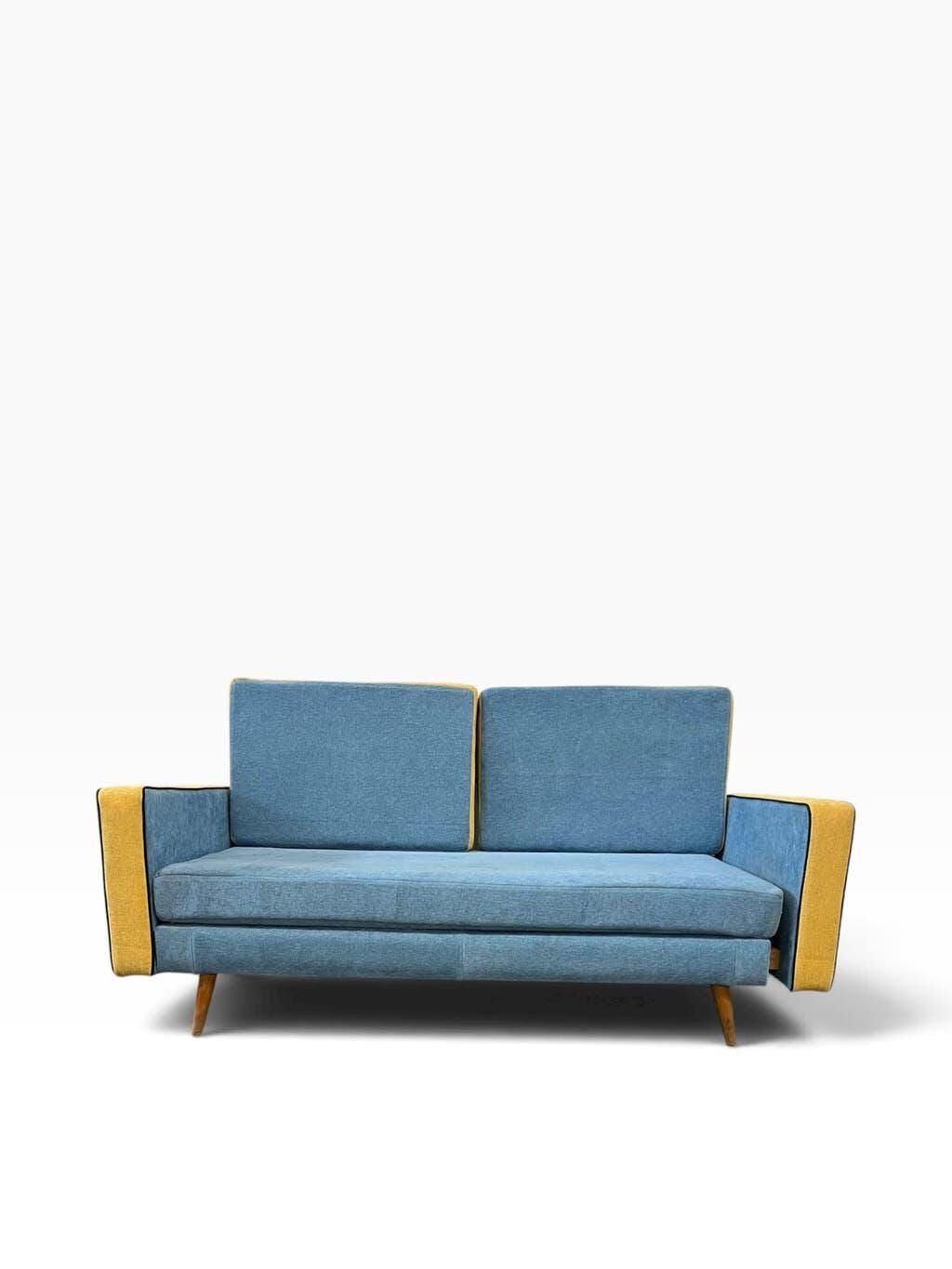 Vintage blue armchair/daybed/sofa bed with yellow accents.