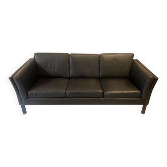 Black leather three-seater sofa