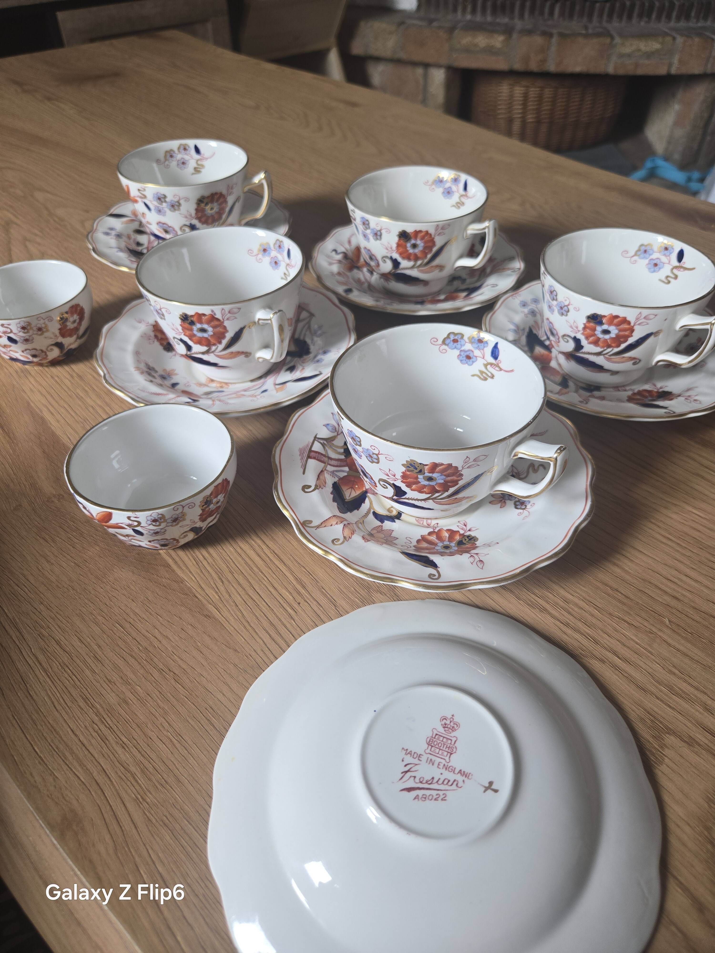 5 tea cups with saucers and 2 small pots, made in England.