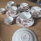 5 tea cups with saucers and 2 small pots, made in England.