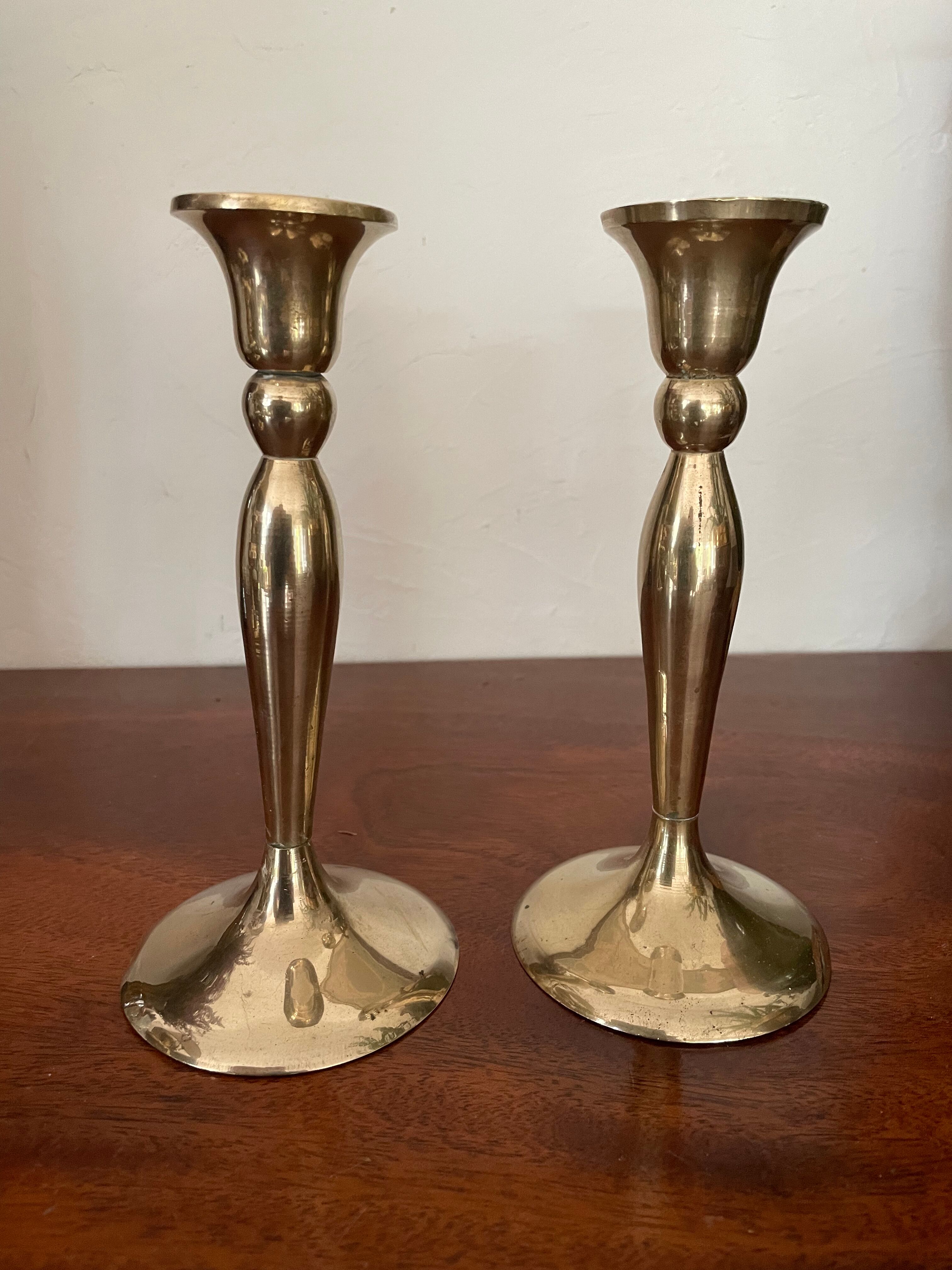 Three vintage brass candle holders