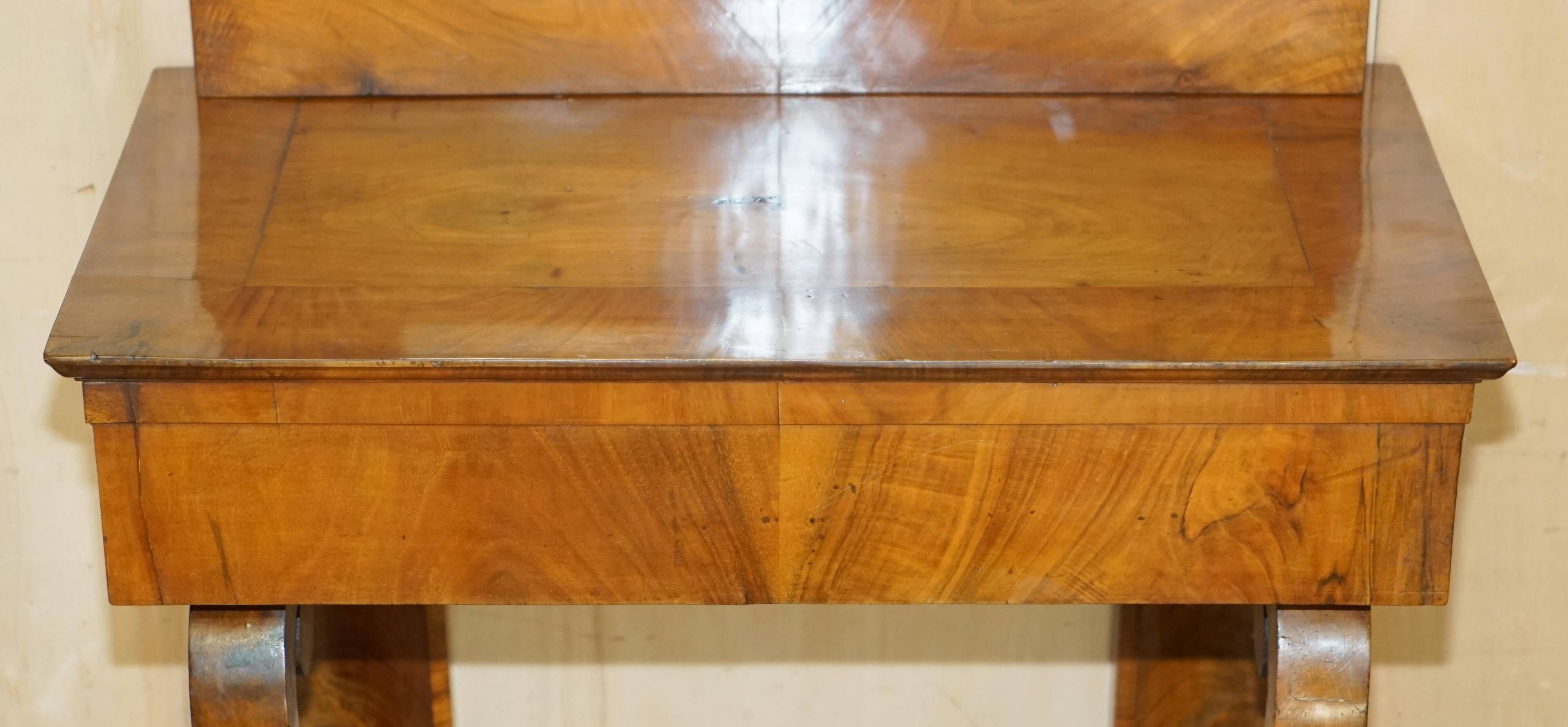 Pair of restored antique consoles from around 1815 in walnut, Regency style with mirror.